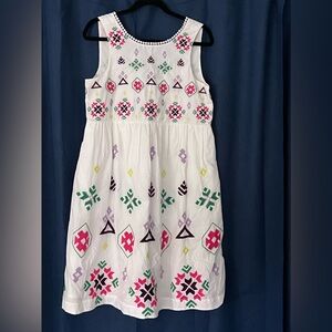 Cute Anthropologie dress, size M, white w/geometric design in various colors.